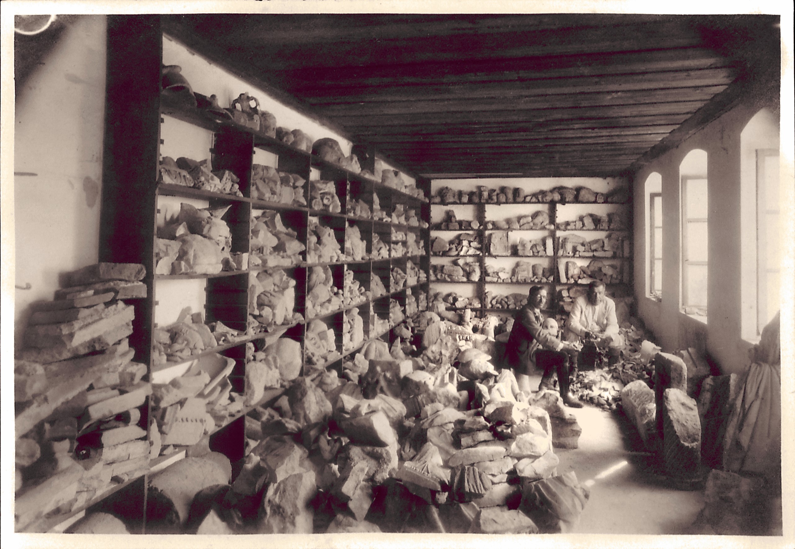 Aziz Ogan in a storage of archaeological artifacts